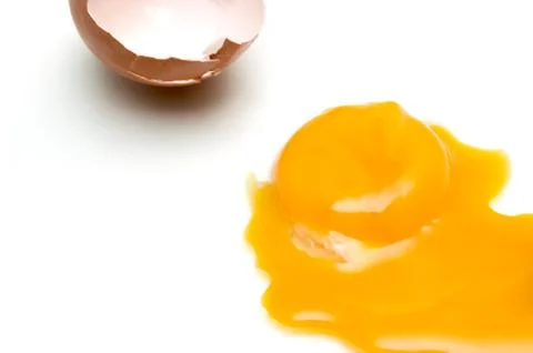 Broken egg isolated on white background Stock Photos