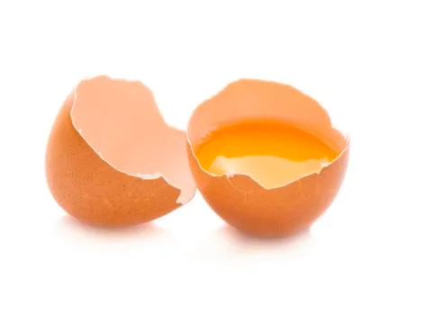 Broken egg isolated on white background Stock Photos