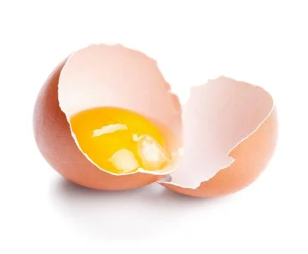 Broken egg isolated on white Stock Photos