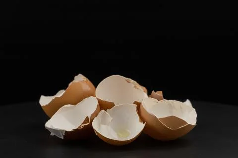 Broken of egg shell group crack  isolated on black background Stock Photos