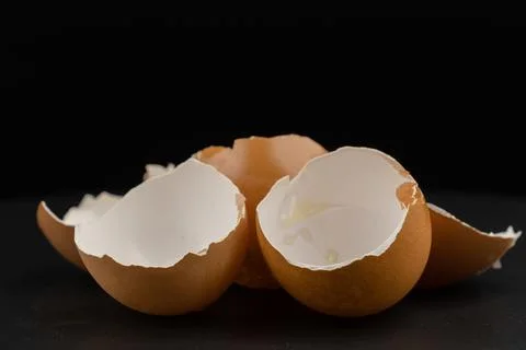 Broken of egg shell group crack  isolated on black background Stock Photos