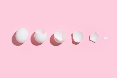 Broken egg shells on pink background Foto stock