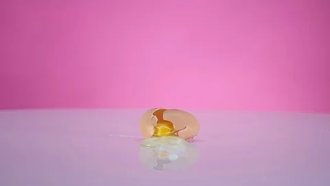 Broken egg on the table Stock Footage 76954671