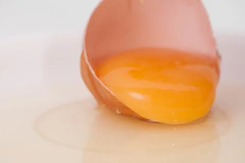 Broken egg on white background close up Stock-Fotos