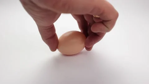 Broken egg on a white background. Homemade egg, white and yolk Stock Footage 236759988