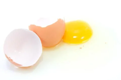 Broken egg on white background Stock Photos