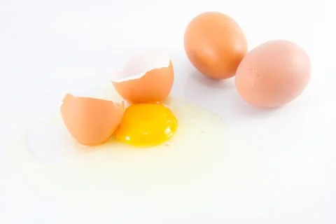 Broken egg on white background Stock Photos