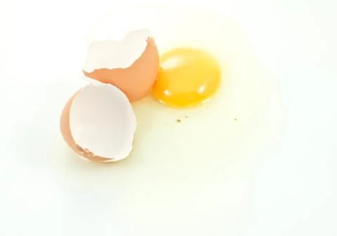 Broken egg on white background Stock Photos