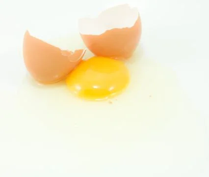 Broken egg on white background Stock Photos