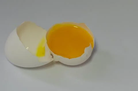 Broken egg on white background Stock Photos
