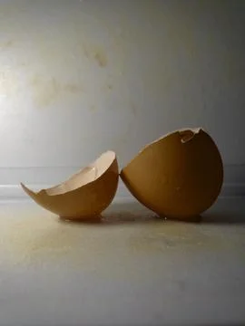 Broken egg with white background Stock Photos