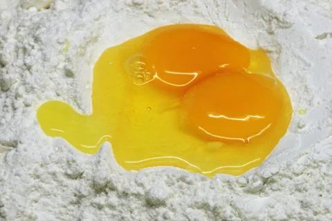 Broken eggs and flour Stock Photos