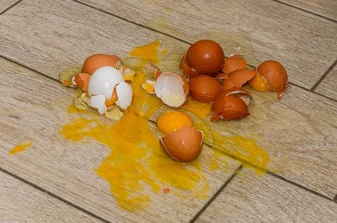 Broken eggs on the floor Stock Photos