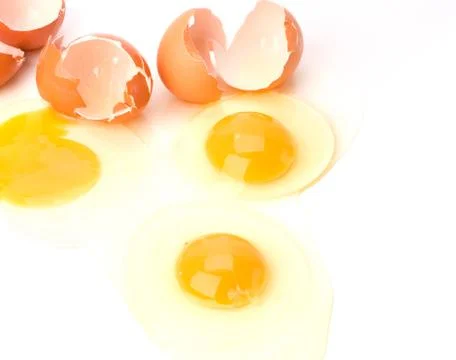 Broken eggs isolated on white background Stock Photos
