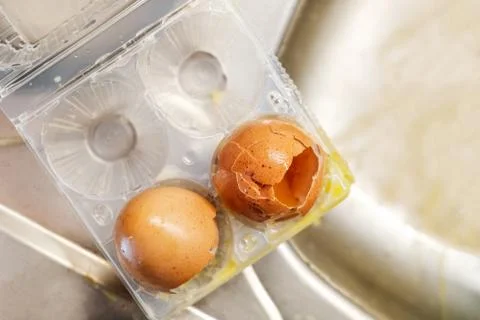 Broken eggs pack box Stock Photos