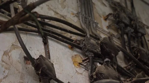 Broken Electrical supply cable wiring in decaying abandoned building Видео 325943290