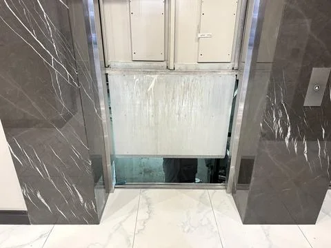 Broken elevator being repaired without identification knowledge silver color Stock Photos