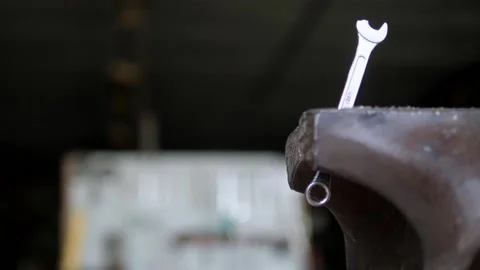 Broken end wrench in vice in old garage Stock Footage 195982020
