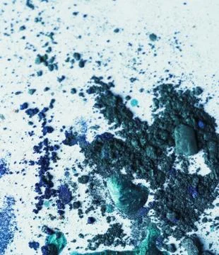 Broken eye-shadows and drops of nail lacquer Stock Photos