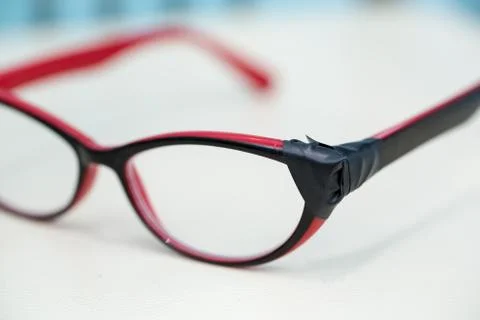 Broken Eyeglasses on White Background Stock Photos