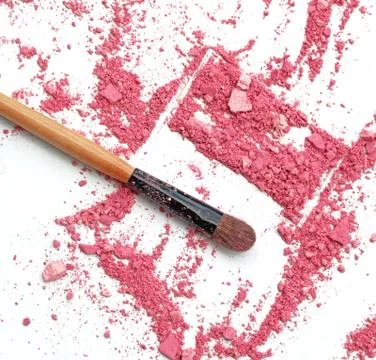 Broken eyeshadows with brush use as background Stock Photos
