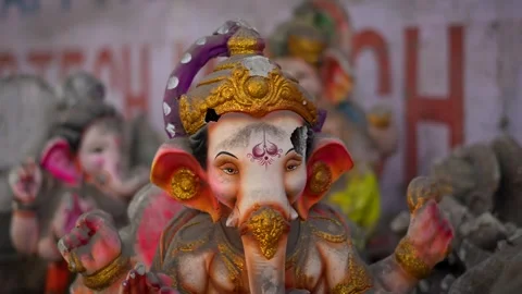 Broken Ganesha Statue Covered with Mud Lying on Roadside After Festival Imm.. Stock Footage 326360957