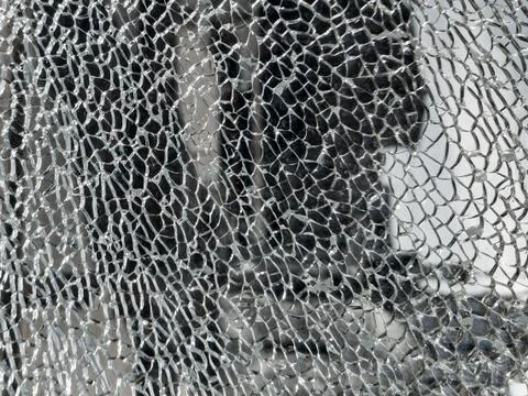 Broken glass background with a web pattern with the city in the background. D Foto stock