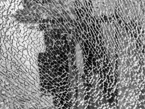 Broken glass background with a web pattern with the city in the background. D 스톡 사진