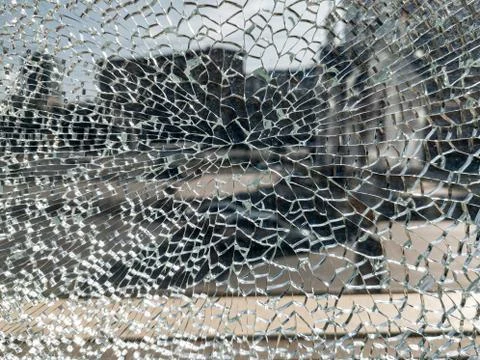 Broken glass background with a web pattern with the city in the background. D Foto stock
