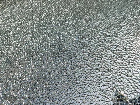 Broken glass background with a web pattern with the city in the background. D Stock Photos