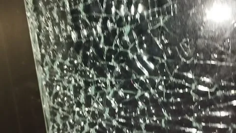 Broken glass. Camera movement across the broken glass. Stock-Footage 304130693