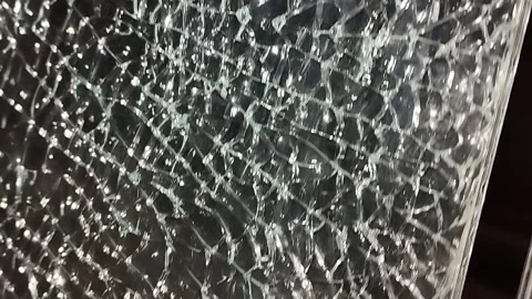 Broken glass. Camera movement across the broken glass. Stock-Footage 304130730