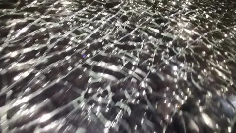 Broken glass. Camera movement across the broken glass. Stock-Footage 304130737