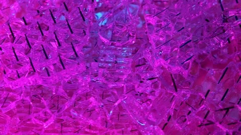 Broken glass close-up. A rotating pile of broken glass in violet light. Stock Footage 160410097