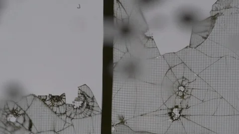 Broken glass reflected in a puddle Stock Footage 92936187