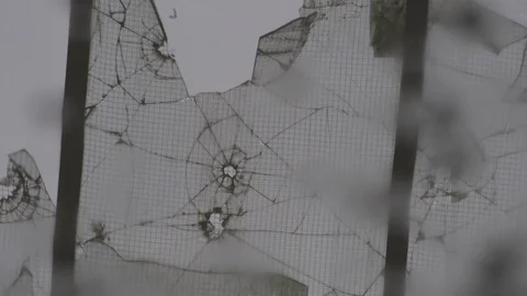 Broken glass reflected in a puddle Video stock 92936197