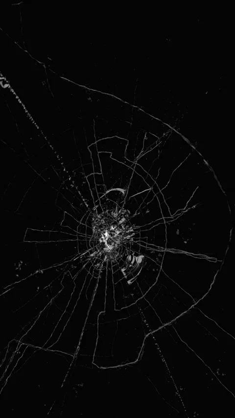 Broken glass screen with circular crack patterns Video stock 337937298