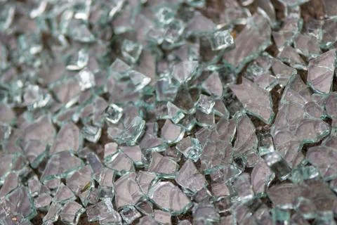 Broken glass on the sidewalk. Stock Photos