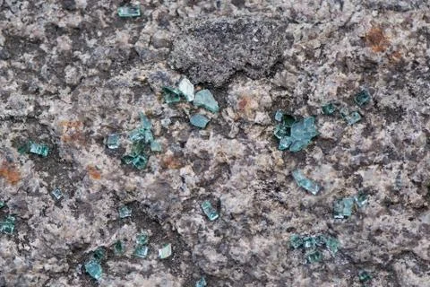 Broken glass on the sidewalk. Stock Photos