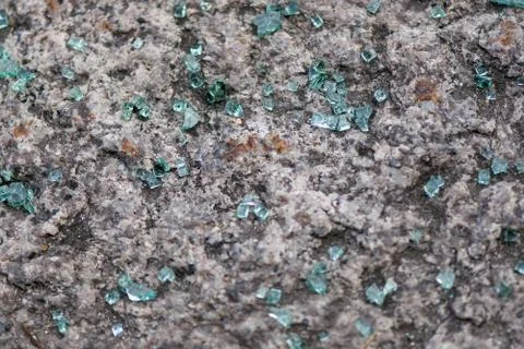 Broken glass on the sidewalk. Stock Photos