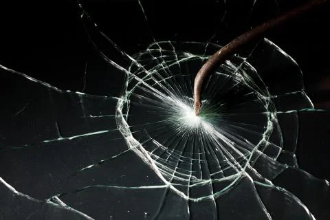 Broken glass texture. rusty crowbar Foto stock