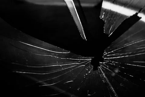 Broken glass with an unknown object Stock Photos