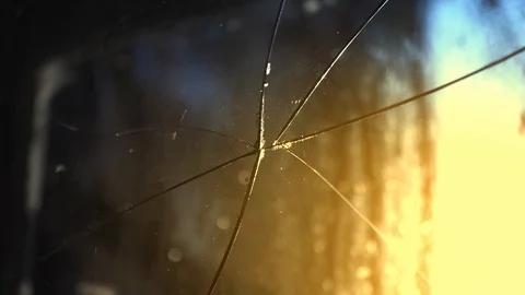 Broken glass on the window. Sun through an old broken window. Stock-Footage 124947630