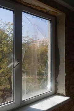 Broken glass windows, broken window from an explosion., Stock Photos