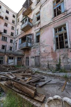 Broken glass in the windows of an old abandoned mystical house. A horror pict Stock Photos