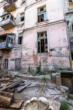 Broken glass in the windows of an old abandoned mystical house. A horror pict Stock Photos