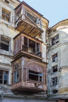 Broken glass in the windows of an old abandoned mystical house. A horror pict Stock Photos