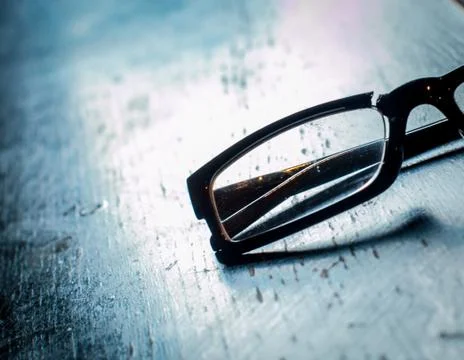 Broken glasses on table Stock Photos