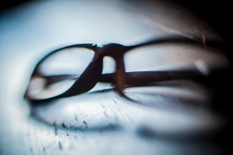 Broken glasses on table Stock Photos