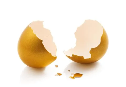 Broken golden egg Stock Photos